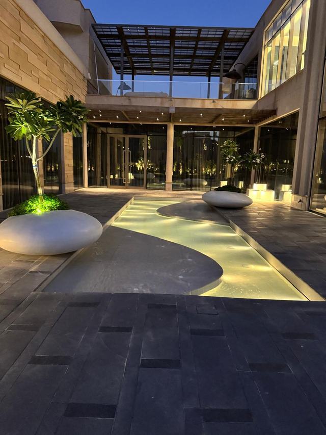 Entrance court with planters and a water channel